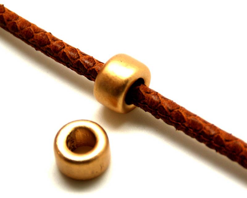 Ceramic. Rondelle. 15x9mm. Gold color mat. Inn.8mm.