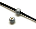 Ceramic. Round. 8mm. Silver color mat. Inn.3mm.approx.