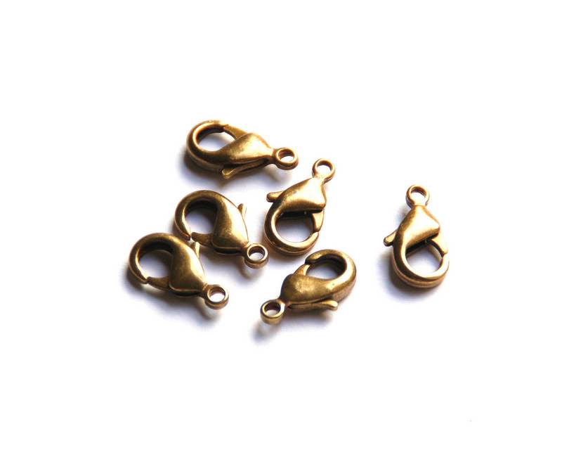Zamak. Lobster clasp 8x15mm. gold color.
