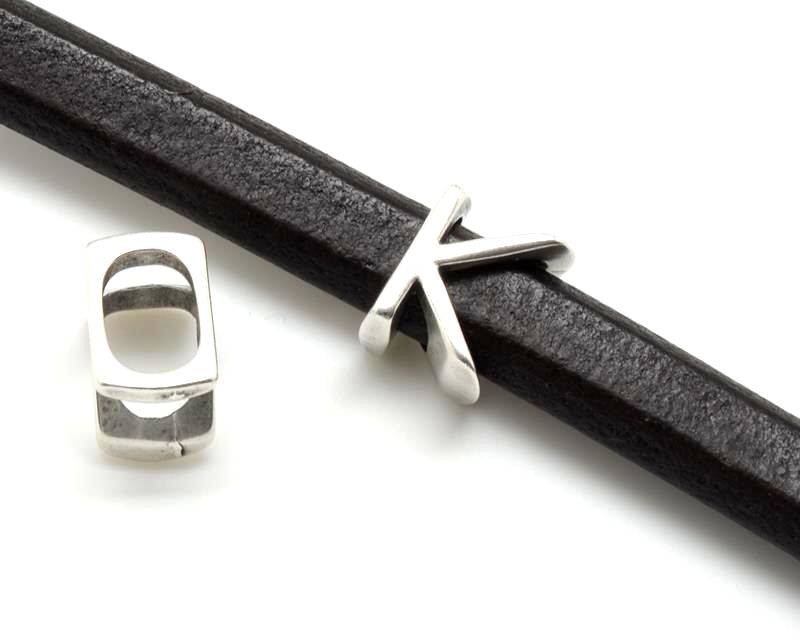 Zamak. Letter K . Silver color. Inn.10x7mm.