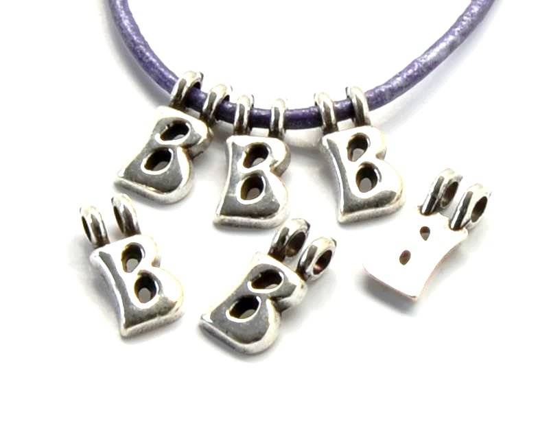 Zamak. Pendant. Letter . Silver color. 9mm. Inn.2.2mm.