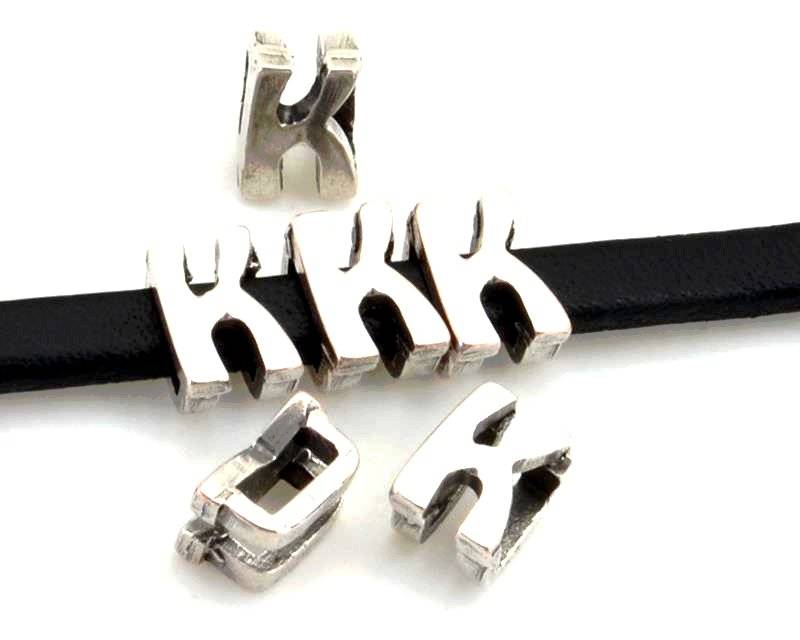 Zamak. Letter K. 9.5mm. Silver color. Inn.6x2.5mm.