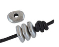 Zamak irregular rondelle. 12x9.5mm. Silver. Int.3mm