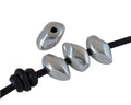 Zamak irregular rondelle. 12x7mm. Silver. Int.1.8mm