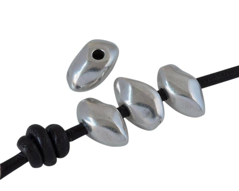 Zamak irregular rondelle. 12x7mm. Silver. Int.1.8mm