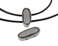 Zamak slider two holes. 29.5x12.5x9mm oval. Silver. Inn.2.5mm