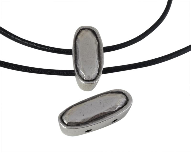 Zamak slider two holes. 29.5x12.5x9mm oval. Silver. Inn.2.5mm