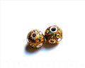 Resin. Round, 13mm. Gold color. Inn. 3mm. approx. 2 Ud.