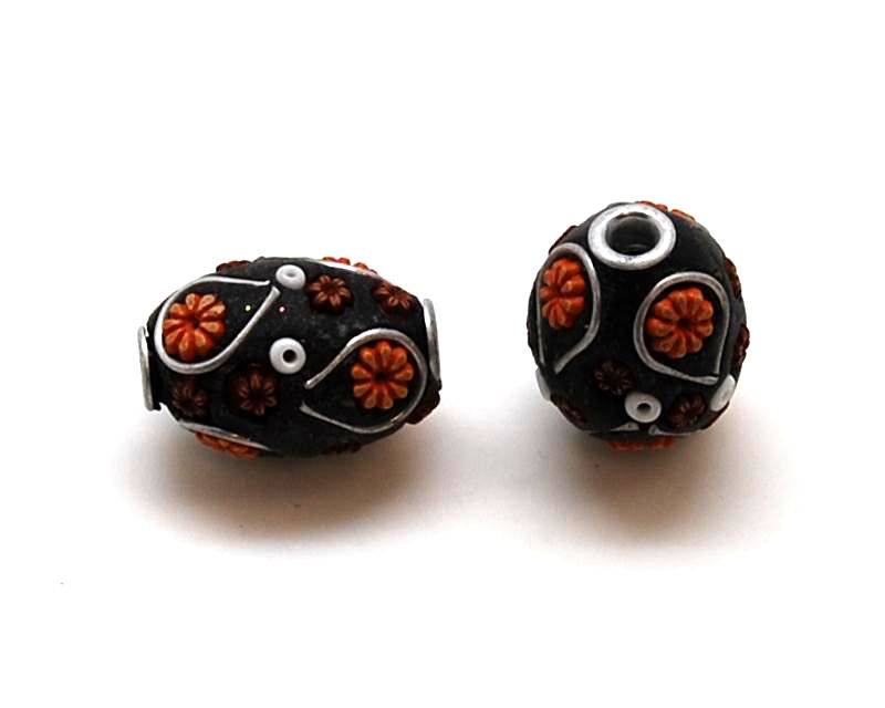 Resin. Barrel. 17x11mm. Black-flowers. Inn.3mm.approx.