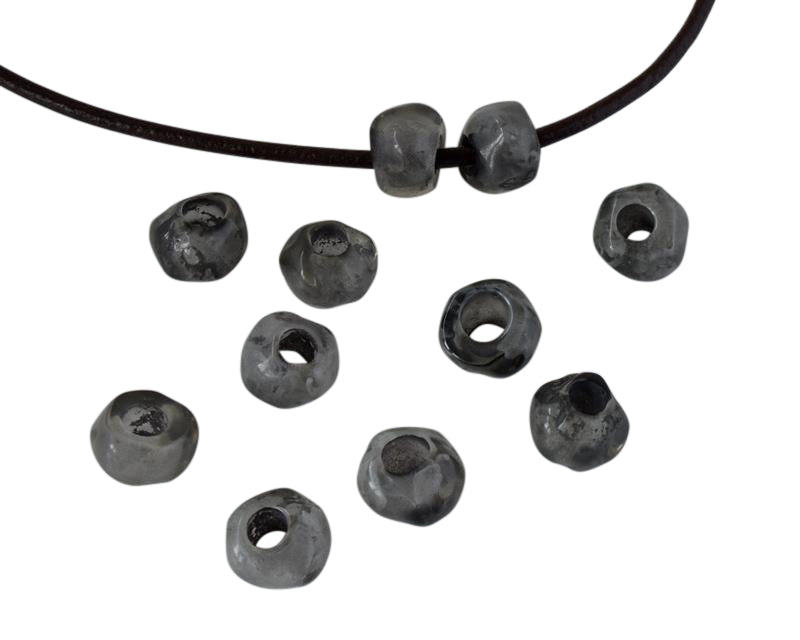 Resin irregular rondell 9x9x7mm. Marbled grey. Inn.3mm aprox. Best Quality.
