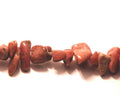Rhodonite, 4-7mm chips. Sold per 32-inch strand.