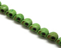 Magnesite. Skull. 14x18mm. Green. Inn. 1mm. approx. 21 PCs.