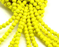 Turquoise. Dyed. Round. 6mm. Fluorescent yellow. Inn.1mm.approx.