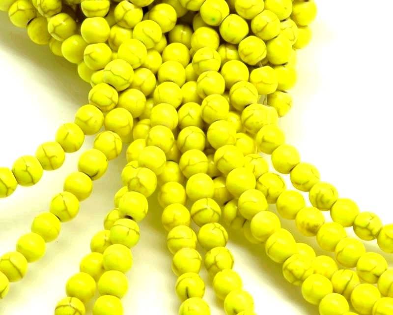 Turquoise. Dyed. Round. 6mm. Fluorescent yellow. Inn.1mm.approx.