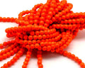 Turquoise. Dyed. Round. 6mm. Fluorescent orange. Inn.1mm.approx.