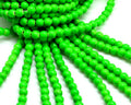 Turquoise. Dyed. Round. 6mm. Fluorescent green2. Inn.1mm.approx.