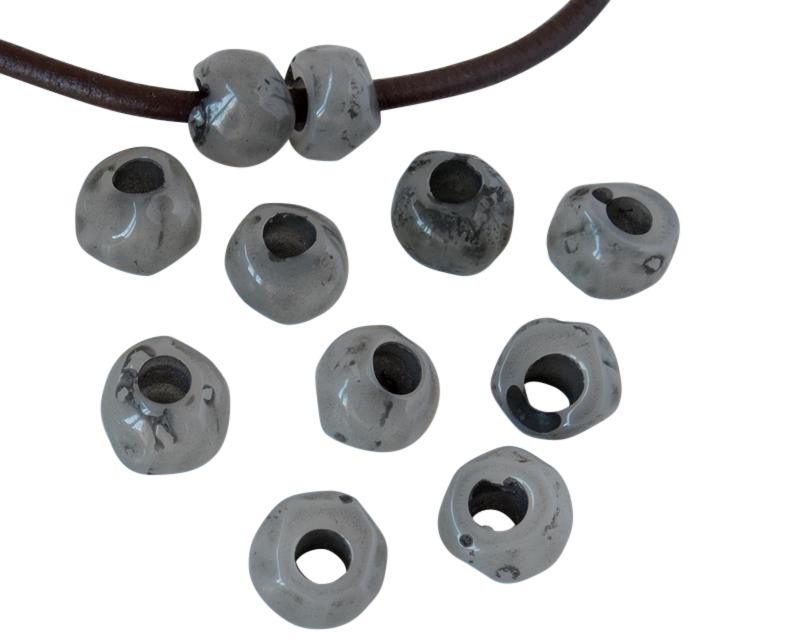 Resin irregular rondell 9x9x7mm. Opaque grey. Inn.3mm aprox. Best Quality.