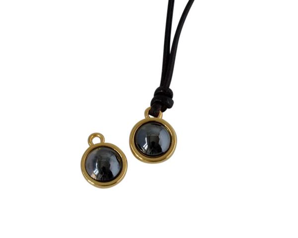Swarovski and metal pendant coin 9x5x9.5mm. Gold-Jet Hematite Pearl. Inn1.8mm