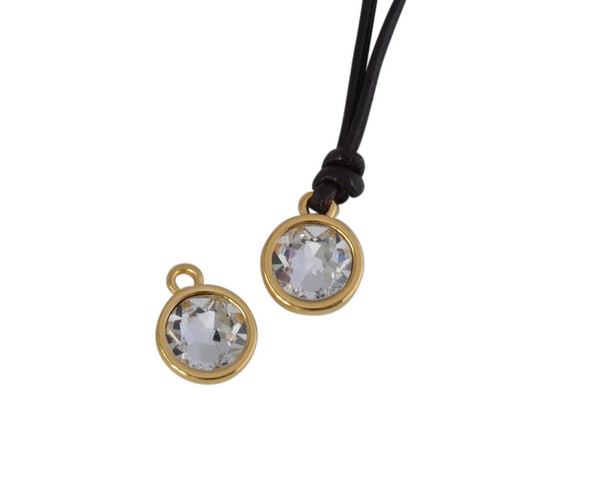 Swarovski and metal pendant coin 9x5x9.5mm. Gold-Crystal. Inn1.8mm
